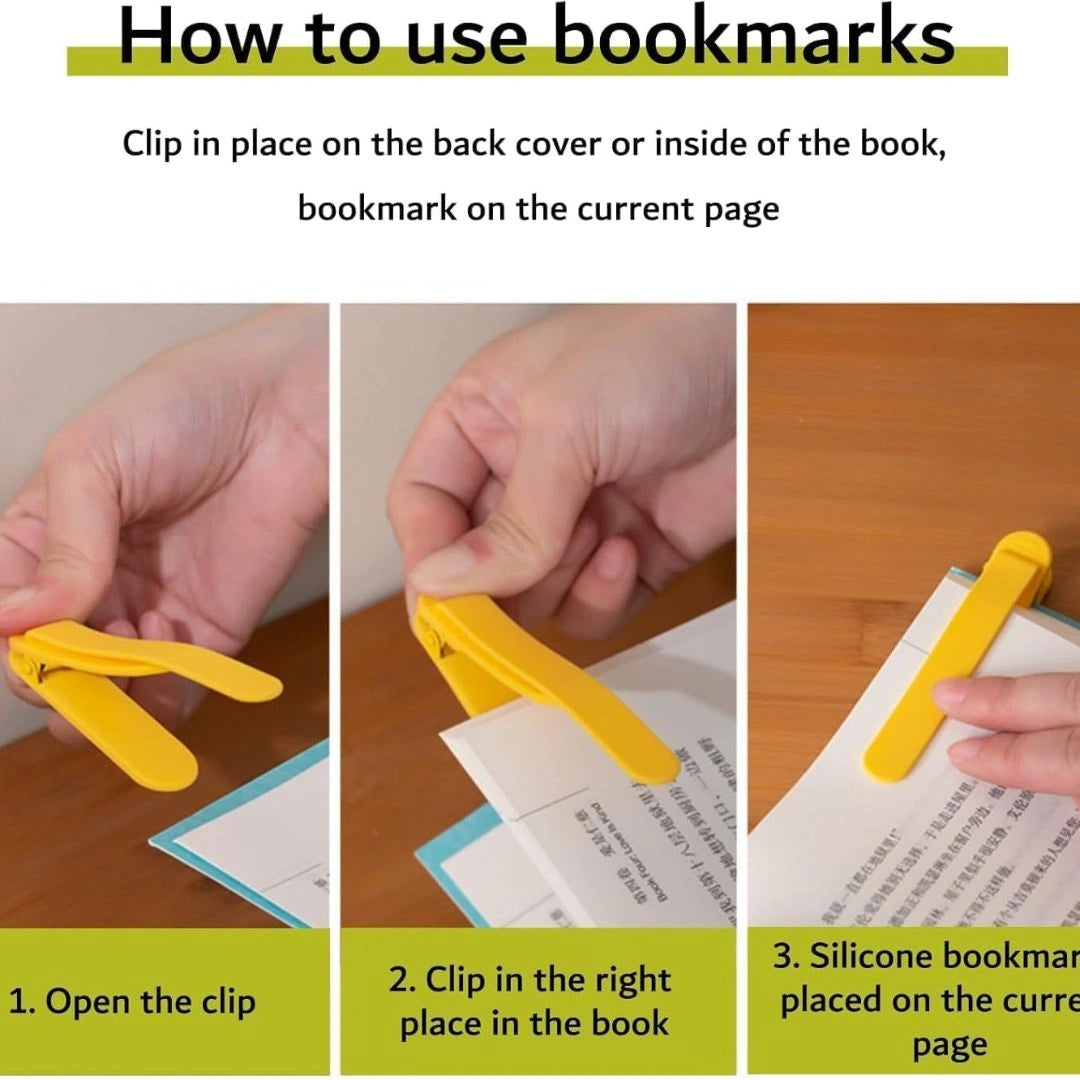 Multiple colourful bookmark clips on book pages